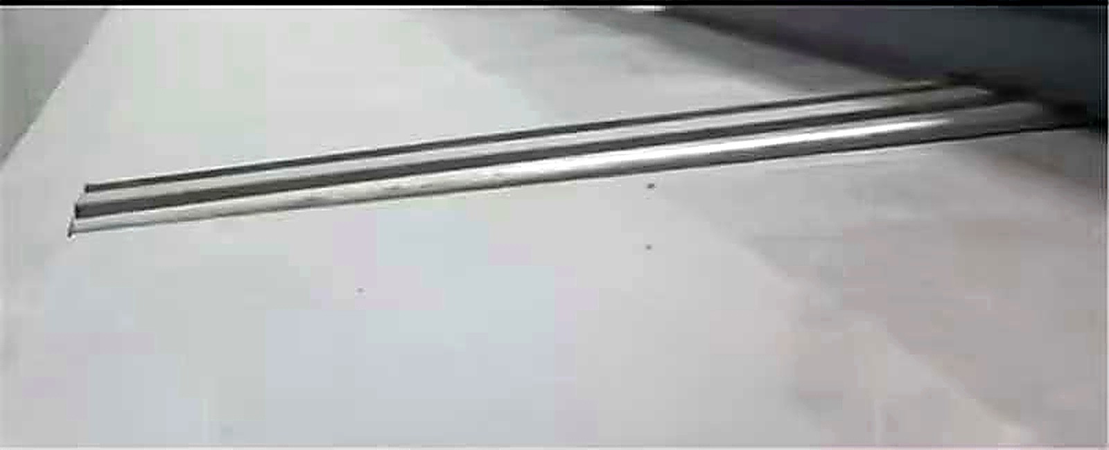 Galvanised rail close-up on a prepared floor
