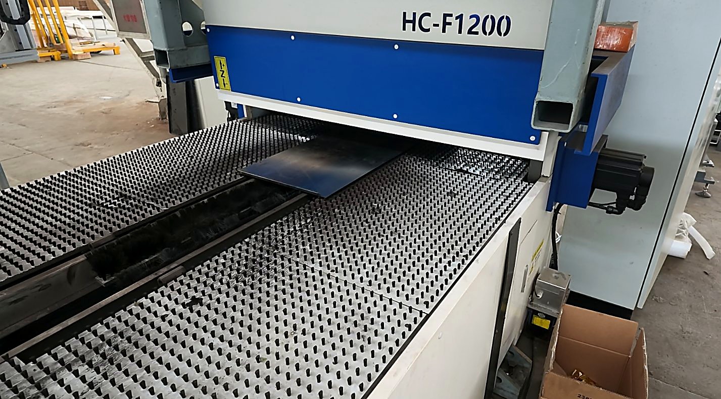 CNC punching machine HC-F1200 perforating a steel shelf panel