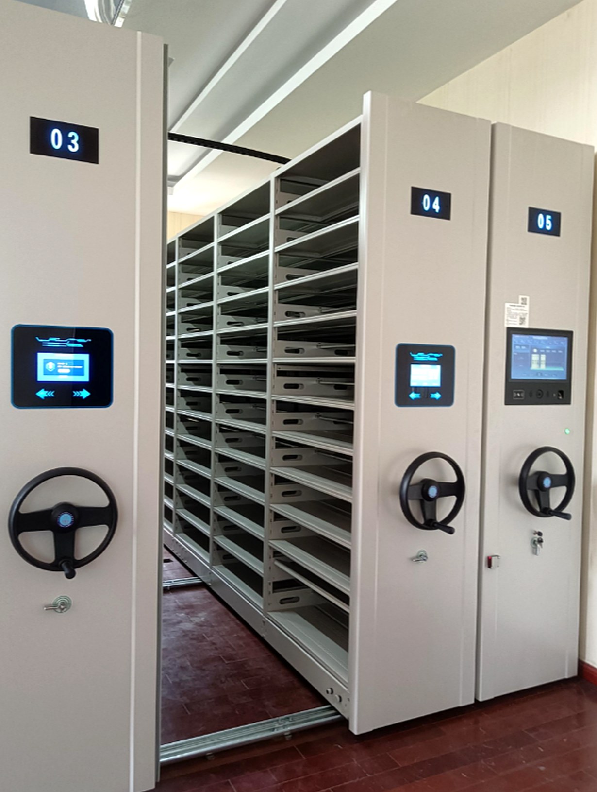 Voucher smart shelving bays 03 to 05 open on their rails, shallow layers fully visible
